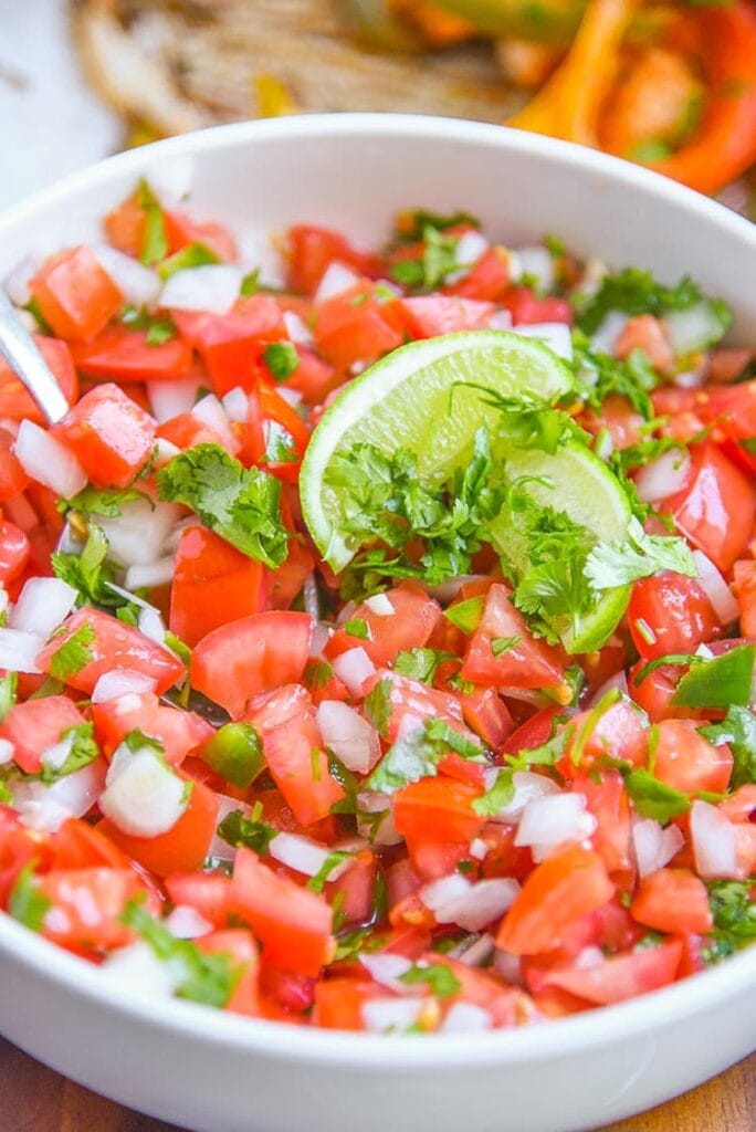 A close up of healthy pico de gallo in a bowl