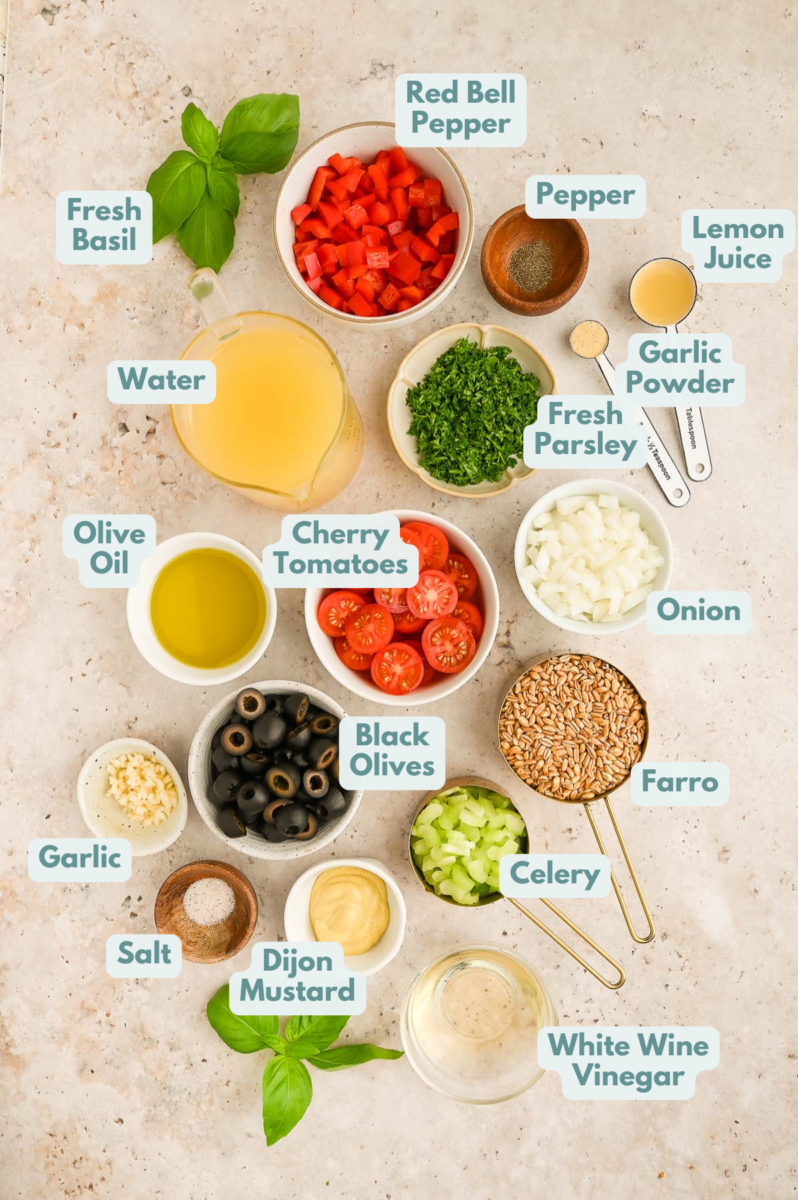 Ingredients to make easy farro salad and measuring cups on a counter.