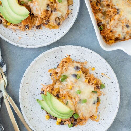 Spaghetti Squash Casserole on a white plate with a second dish and casserole dish off to the side