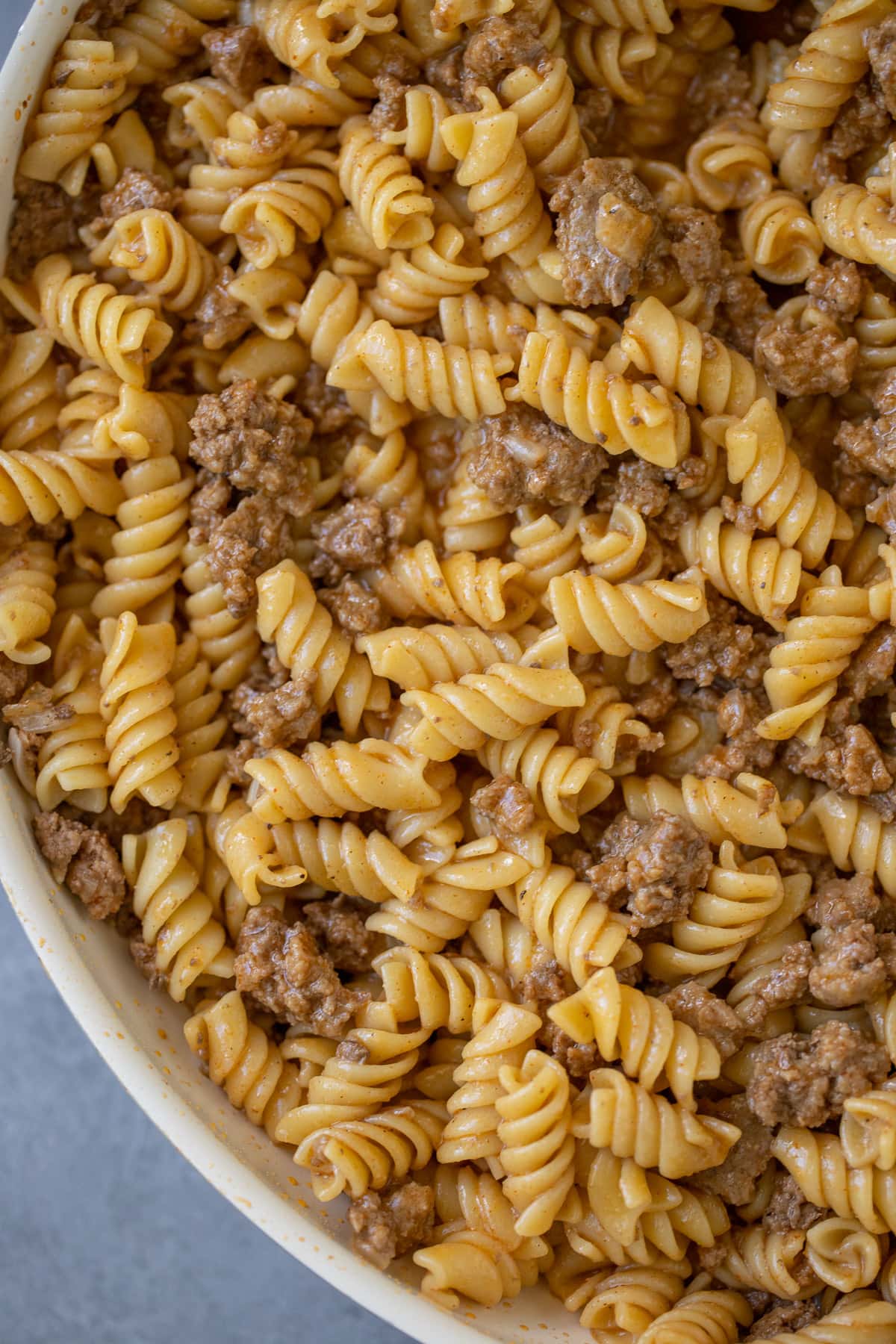 Overhead close up of rotini pasta dinner with ground beef.