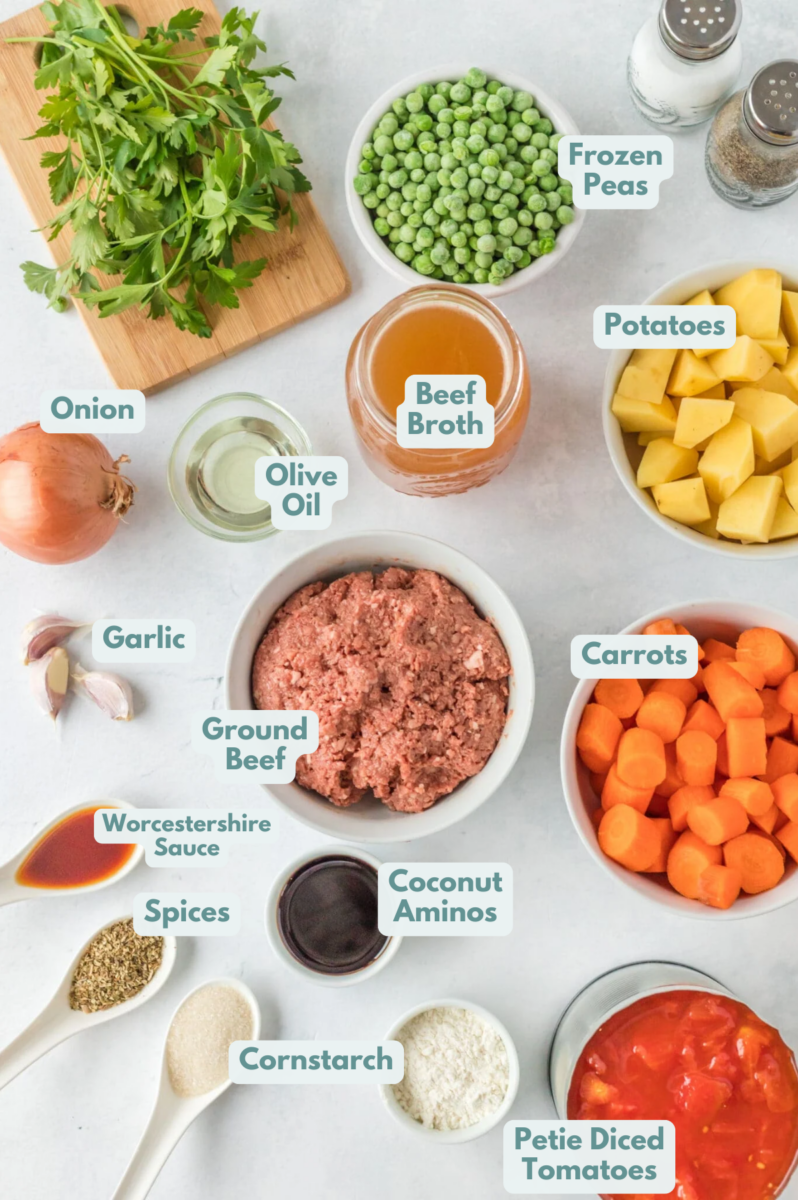 Ingredients for Hamburger Stew in small white bowls on a white background