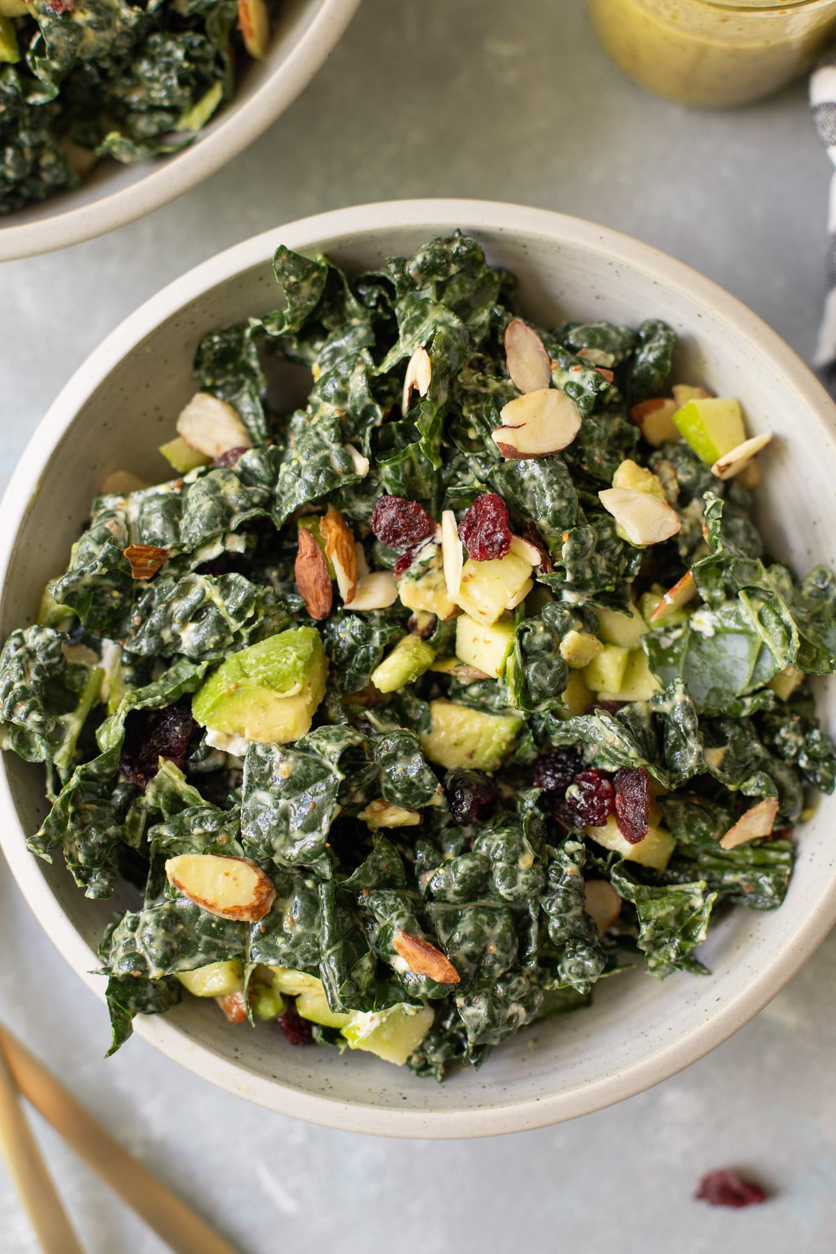 A close up of kale salad tossed with lemon Dijon dressing.