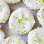 An overhead shot of a plate of key lime cheesecakes