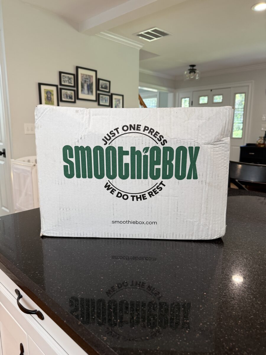 A white smoothie box box on a black counter