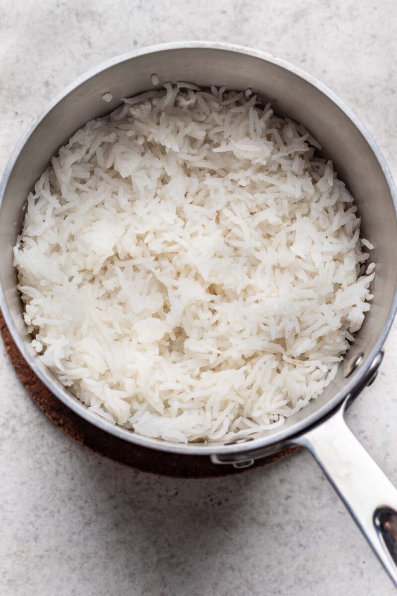 White rice cooked in a small pot. 