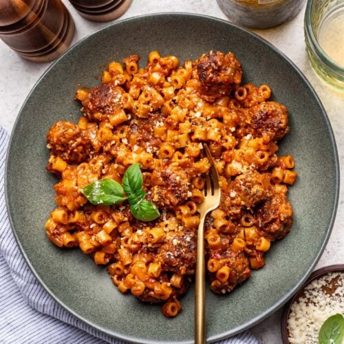 One Pot Meatball Pasta on a plate with a fork in it.
