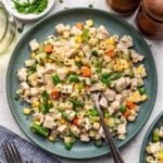 Chicken Pot Pie Pasta on a plate with a fork in it with more herbs and forks on the side.