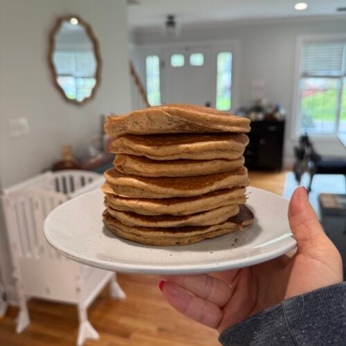 Oat Flour Pancakes stacked high on a plate