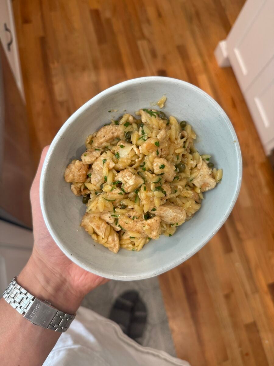 a bowl of chicken piccata orzo