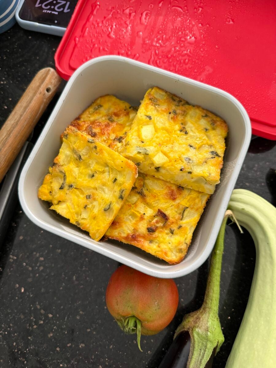 Zucchini egg bake sliced and stored in a container