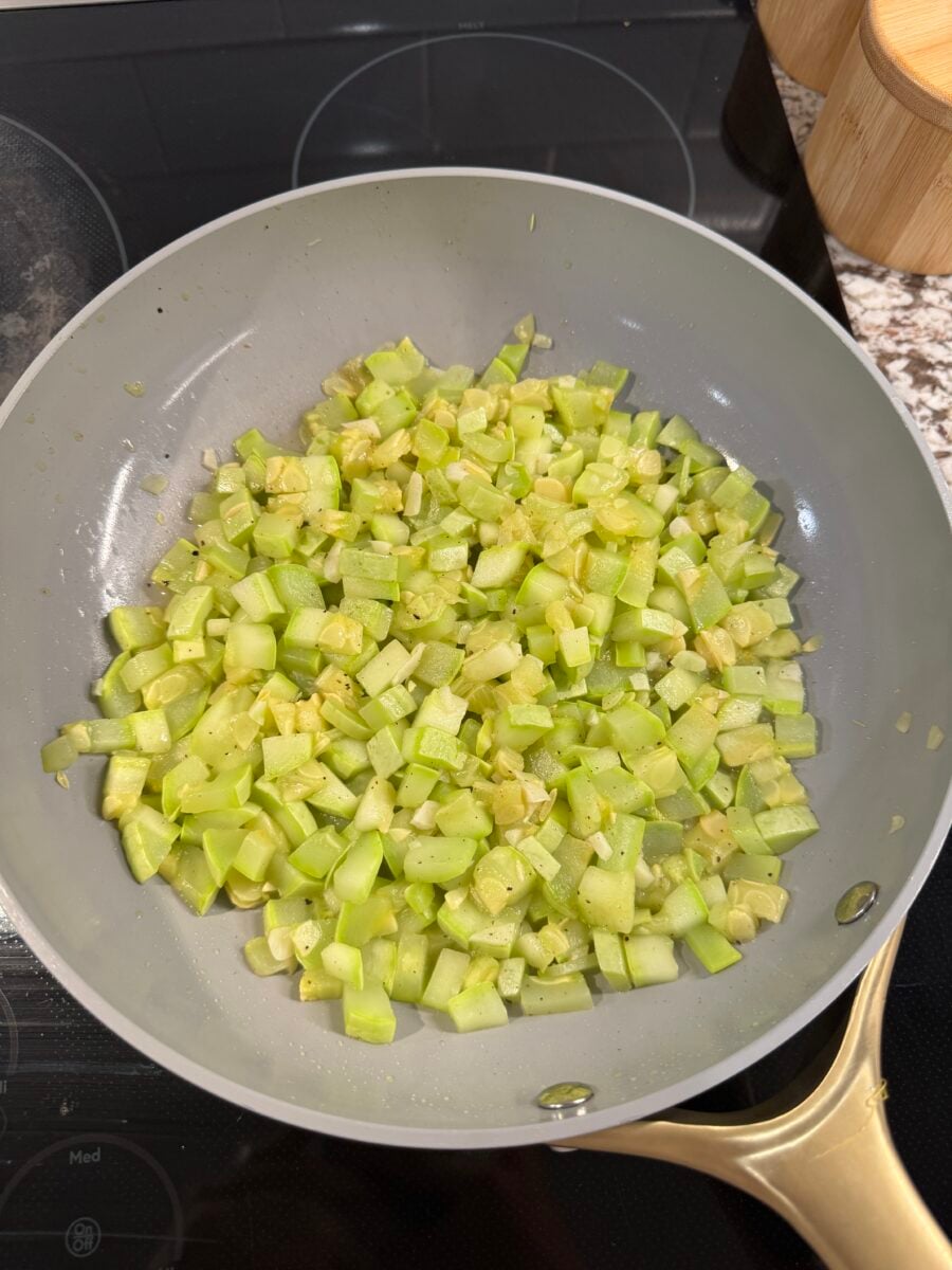 Zucchini sauteing in a pan