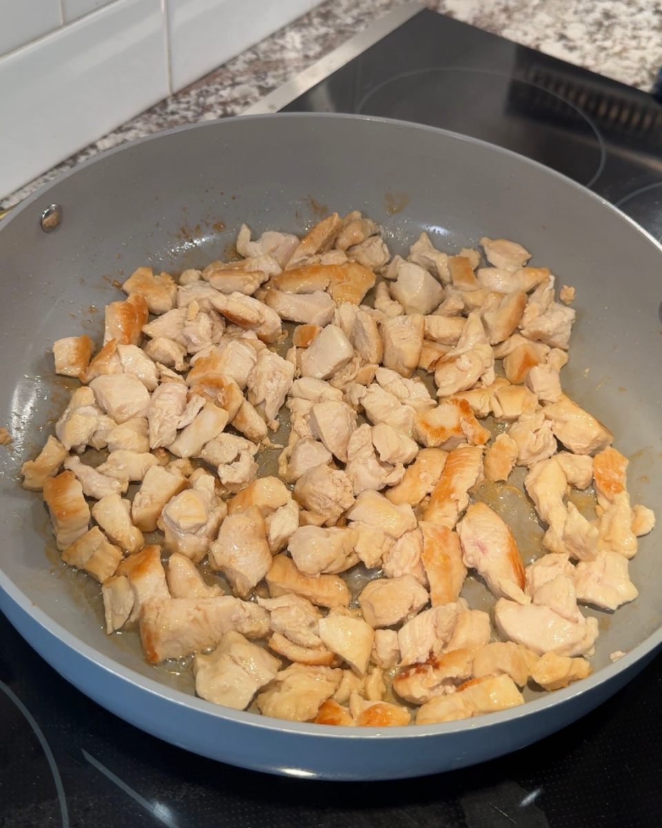 Chicken browning in a pan