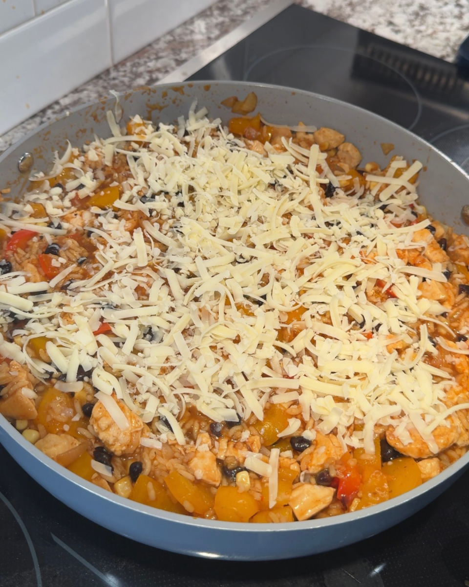 chicken enchilada rice with cheese on top